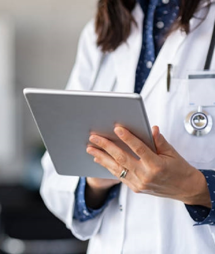 Close up of female doctor wearing a pinafore and a stethoscope