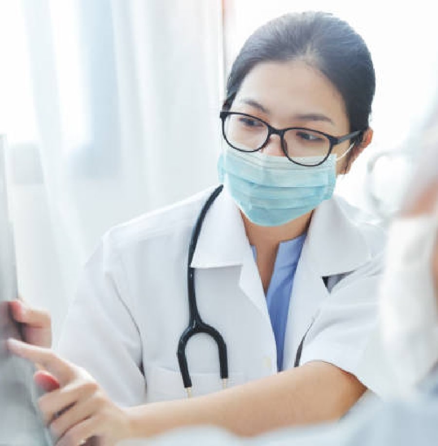 Female doctor showing something to a patient