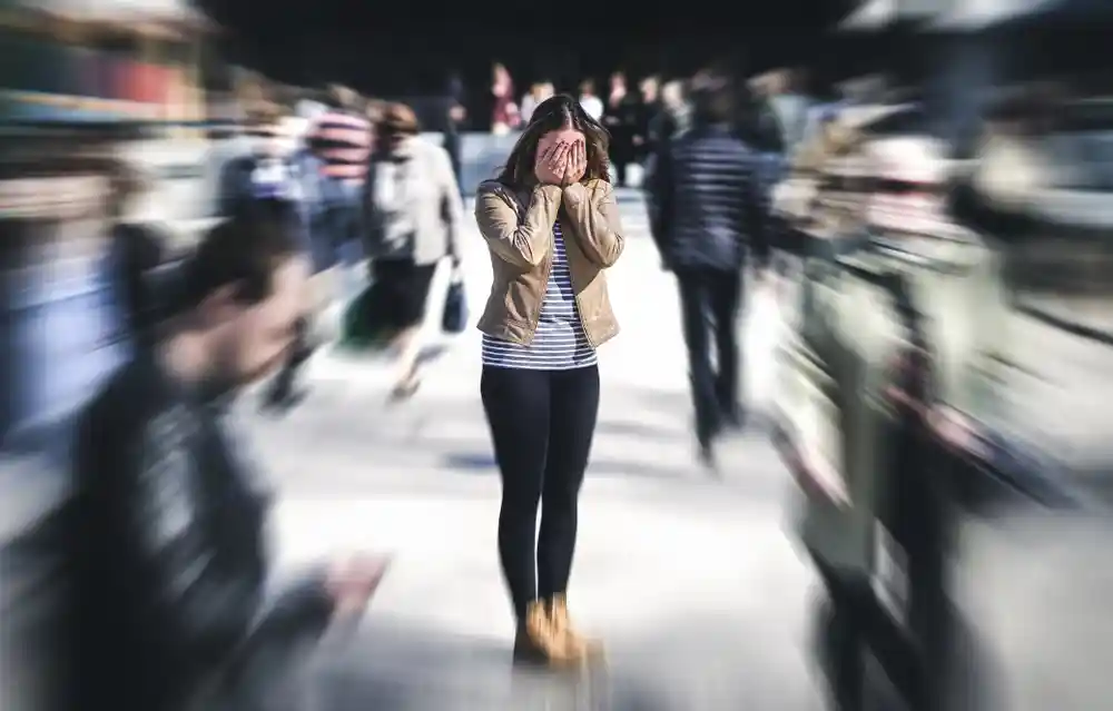 Young woman covering her eyes