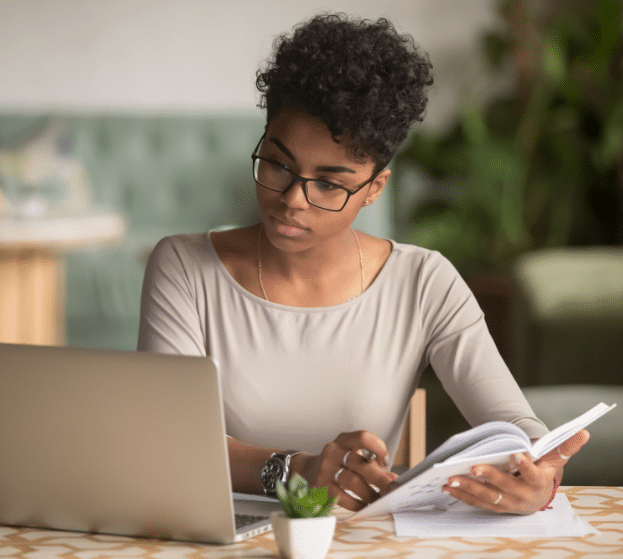 Woman taking notes using her computer