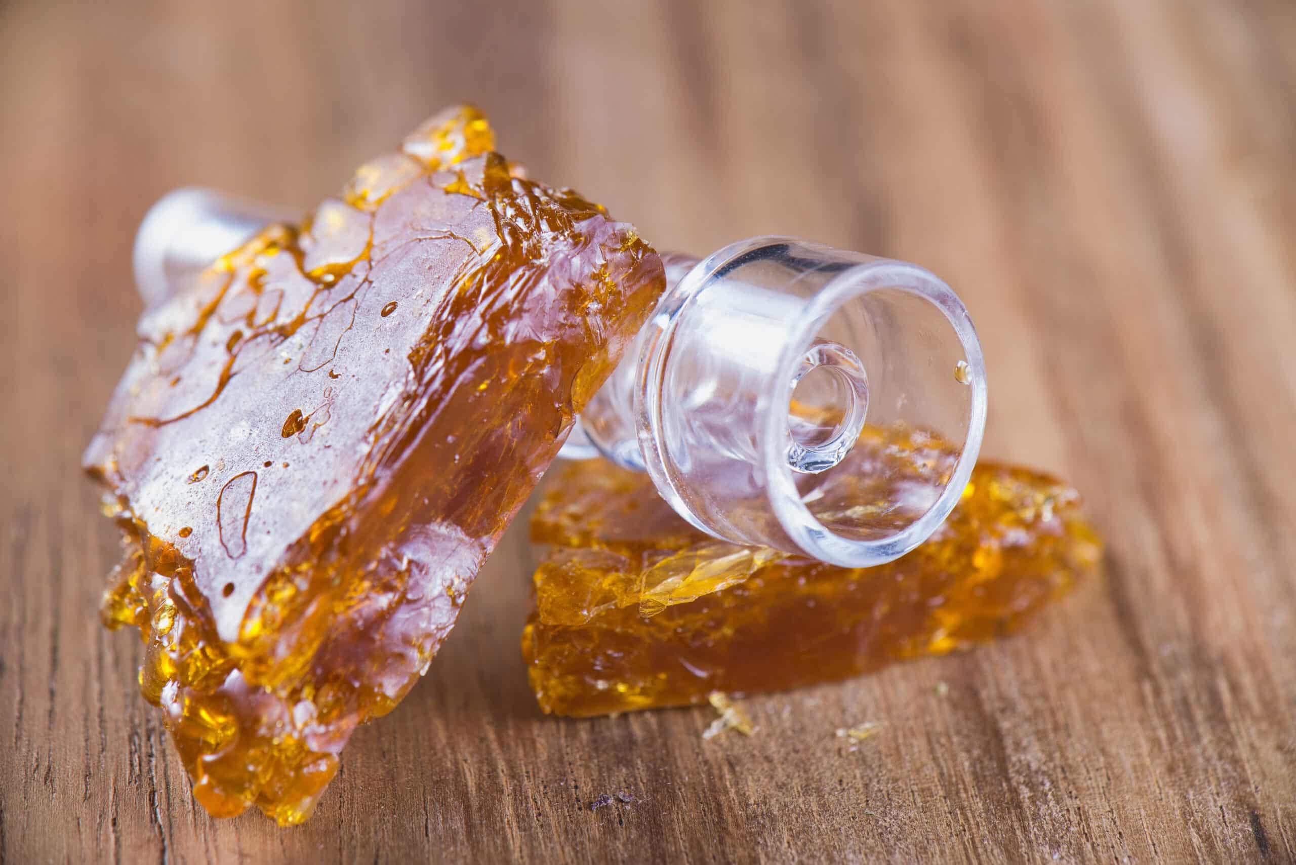 Pieces Of Cannabis Oil Concentrate Aka Shatter With Glass Rig